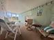 Relaxing sunroom with wicker furniture and screened enclosure at 209 N Saint Thomas Cir, Apollo Beach, FL 33572