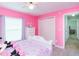 Pink bedroom with matching dressers and closet space at 23635 Oakside Blvd, Lutz, FL 33559