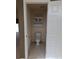 Small half bathroom with toilet and cabinet at 2365 Ardenwood Dr, Spring Hill, FL 34609