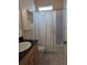 Bathroom with shower/tub, vanity, and built-in shelving at 2365 Ardenwood Dr, Spring Hill, FL 34609