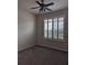 Spacious bedroom with window shutters and carpeting at 2365 Ardenwood Dr, Spring Hill, FL 34609