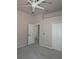 Spacious bedroom with ceiling fan and double closets at 2365 Ardenwood Dr, Spring Hill, FL 34609