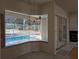 Bright dining area with pool view and sliding glass doors at 2365 Ardenwood Dr, Spring Hill, FL 34609