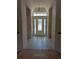 Bright entryway with tile floor and hardwood accents at 2365 Ardenwood Dr, Spring Hill, FL 34609