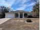 Single-story home with attached garage and landscaping at 2365 Ardenwood Dr, Spring Hill, FL 34609