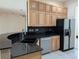 Kitchen with granite countertop and wood cabinets at 2365 Ardenwood Dr, Spring Hill, FL 34609