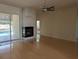 Living room with fireplace and sliding glass doors at 2365 Ardenwood Dr, Spring Hill, FL 34609