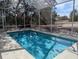 Sparkling screened-in pool and patio area at 2365 Ardenwood Dr, Spring Hill, FL 34609