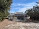 House with a screened-in pool and backyard at 2365 Ardenwood Dr, Spring Hill, FL 34609