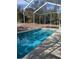 Inviting screened-in pool with ample surrounding space at 2365 Ardenwood Dr, Spring Hill, FL 34609