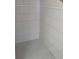 Small shower with light grey tile at 2365 Ardenwood Dr, Spring Hill, FL 34609