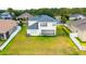 Two-story house with a backyard and a fenced perimeter at 3533 Juneberry Drive, Wesley Chapel, FL 33543