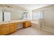 Main bathroom with double vanity and shower at 3533 Juneberry Drive, Wesley Chapel, FL 33543