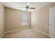 Second bedroom with ceiling fan and window at 3533 Juneberry Drive, Wesley Chapel, FL 33543