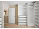 Spacious walk-in closet with ample shelving and drawers at 3533 Juneberry Drive, Wesley Chapel, FL 33543