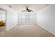 Main bedroom with large window and ceiling fan at 3533 Juneberry Drive, Wesley Chapel, FL 33543
