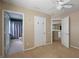 Bedroom with ceiling fan and access to bathroom at 3533 Juneberry Drive, Wesley Chapel, FL 33543