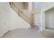 Bright and spacious entryway with tiled floors and staircase at 3533 Juneberry Drive, Wesley Chapel, FL 33543