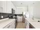 Modern kitchen with stainless steel appliances and white cabinets at 3533 Juneberry Drive, Wesley Chapel, FL 33543