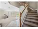 Elegant staircase leading to upper level at 3533 Juneberry Drive, Wesley Chapel, FL 33543