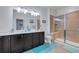 Bathroom boasts double vanity and large walk-in shower at 417 Brandywine Falls Ct, Apollo Beach, FL 33572