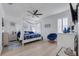 Main bedroom with canopy bed and light wood flooring at 417 Brandywine Falls Ct, Apollo Beach, FL 33572