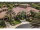 Aerial view of community clubhouse with tile roof, palm trees, and landscaping at 417 Brandywine Falls Ct, Apollo Beach, FL 33572