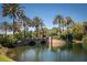 Serene community lake with a stone bridge and lush landscaping at 417 Brandywine Falls Ct, Apollo Beach, FL 33572