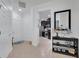 Bright entryway with tile flooring, white walls, and a view of the kitchen at 417 Brandywine Falls Ct, Apollo Beach, FL 33572
