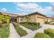 House exterior showcasing a walkway, landscaping, and a two-car garage at 417 Brandywine Falls Ct, Apollo Beach, FL 33572
