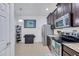 Well-equipped kitchen featuring stainless steel appliances and dark wood cabinetry at 417 Brandywine Falls Ct, Apollo Beach, FL 33572
