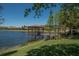 Relaxing gazebo over the lake with a wooden deck at 417 Brandywine Falls Ct, Apollo Beach, FL 33572