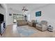Living room featuring a neutral color palette, comfy seating, and a ceiling fan at 417 Brandywine Falls Ct, Apollo Beach, FL 33572