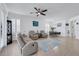 Open living space with seating area, dining table, and kitchen bar at 417 Brandywine Falls Ct, Apollo Beach, FL 33572
