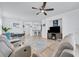 Open concept living room with seating area, dining area, and kitchen view at 417 Brandywine Falls Ct, Apollo Beach, FL 33572
