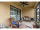 Relaxing screened lanai with wicker furniture, perfect for outdoor enjoyment at 417 Brandywine Falls Ct, Apollo Beach, FL 33572