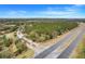 Aerial view of community entrance and surrounding landscape at 4605 Lisette Cir, Brooksville, FL 34604