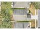 Overhead view of house and backyard, showcasing a fenced yard and driveway at 4605 Lisette Cir, Brooksville, FL 34604