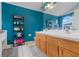 Teal bathroom with double vanity, large mirror, and a separate shower and tub at 4605 Lisette Cir, Brooksville, FL 34604