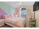 Bright bedroom with pastel walls and comfy bedding at 4605 Lisette Cir, Brooksville, FL 34604