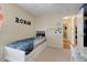 bedroom with twin bed, ample storage, and access to hallway at 4605 Lisette Cir, Brooksville, FL 34604