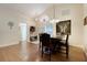 Spacious dining room with hardwood floors, a wooden table, and chairs at 4605 Lisette Cir, Brooksville, FL 34604