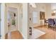 Bright entryway with wood floors and view into dining area at 4605 Lisette Cir, Brooksville, FL 34604