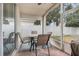 Screened patio with table and chairs, perfect for relaxing at 4605 Lisette Cir, Brooksville, FL 34604
