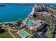 Aerial view of resort-style pool, clubhouse, and tennis/pickleball courts at 4900 Brittany S Dr # 701, St Petersburg, FL 33715