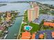 Aerial view showcasing a high-rise building, pool, and ample parking at 4900 Brittany S Dr # 701, St Petersburg, FL 33715