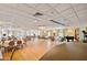 Large banquet hall with tables, chairs and a piano at 4900 Brittany S Dr # 701, St Petersburg, FL 33715