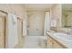 Bathroom with shower/tub combo and updated vanity at 4900 Brittany S Dr # 701, St Petersburg, FL 33715