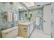 Updated bathroom with light vanity and tile floors at 4900 Brittany S Dr # 701, St Petersburg, FL 33715