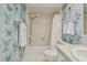 Clean bathroom with shower/tub combo and water themed wallpaper at 4900 Brittany S Dr # 701, St Petersburg, FL 33715